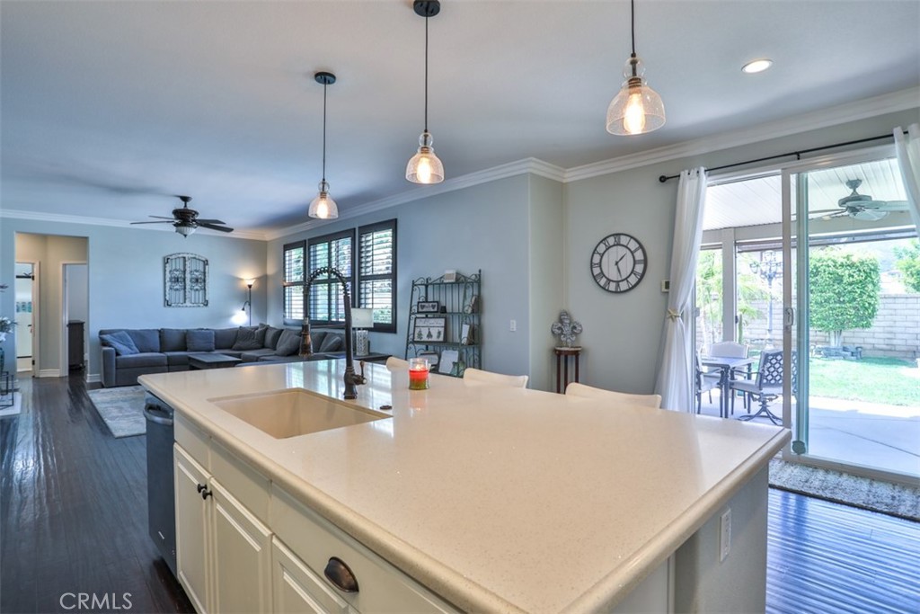 3250 Quartz Circle Corona, CA 92882 - Photo 16 of 68 an open kitchen with a table and chairs in it