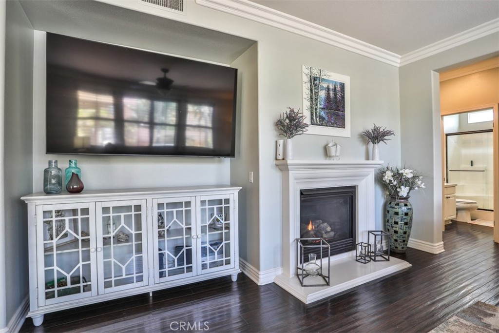 3250 Quartz Circle Corona, CA 92882 - Photo 24 of 68 a living room with furniture and a fireplace