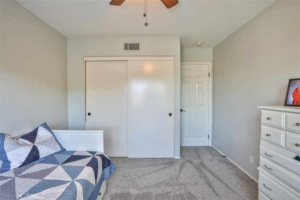 3250 Quartz Circle Corona, CA 92882 - Photo 42 of 68 a view of a bedroom with a bed and cabinet