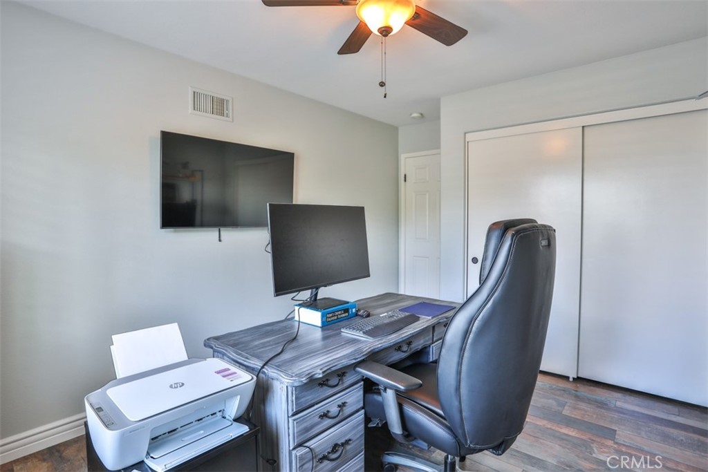 3250 Quartz Circle Corona, CA 92882 - Photo 44 of 68 a view of a workspace with furniture and a flat screen tv
