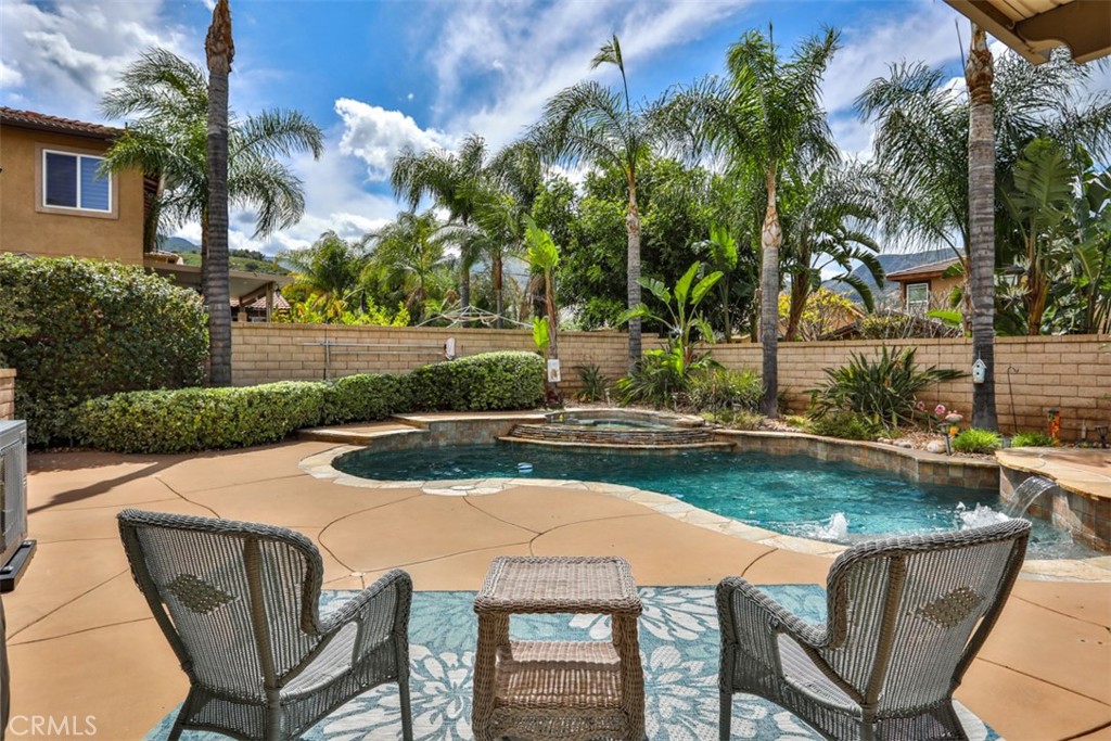 3250 Quartz Circle Corona, CA 92882 - Photo 50 of 68 a view of a table and chairs in patio with swimming pool