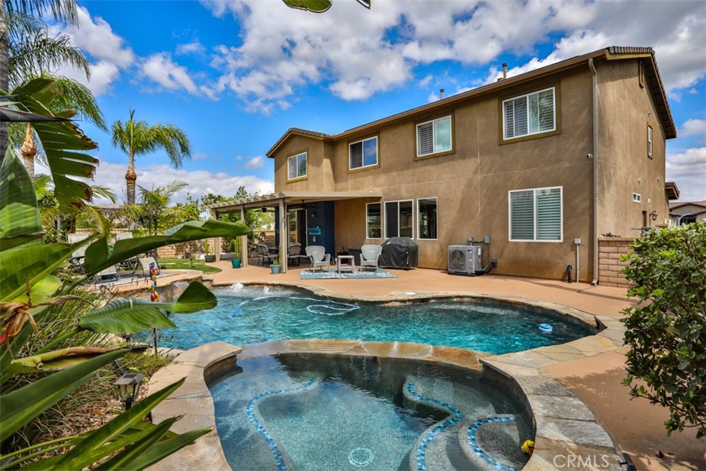3250 Quartz Circle Corona, CA 92882 - Photo 53 of 68 a front view of a house with swimming pool having outdoor seating