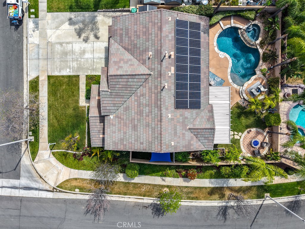 3250 Quartz Circle Corona, CA 92882 - Photo 62 of 68 a front view of a house with a yard and potted plants