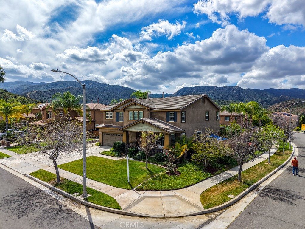 3250 Quartz Circle Corona, CA 92882 - Photo 67 of 68 a view of a house with a yard and potted plants