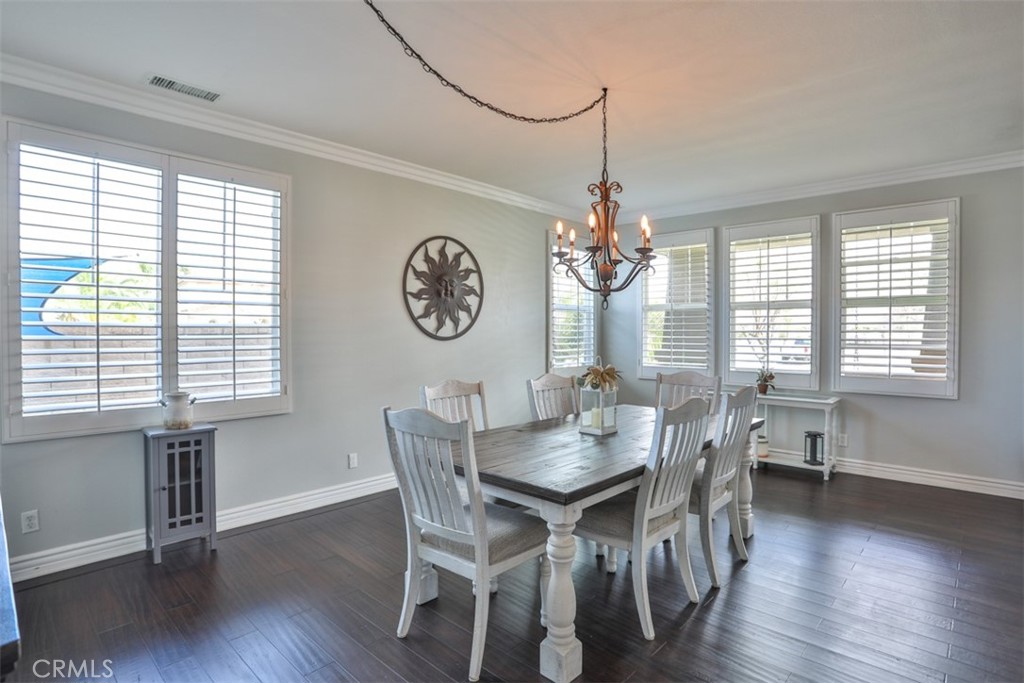 3250 Quartz Circle Corona, CA 92882 - Photo 8 of 68 a view of a dining room with furniture window and wooden floor