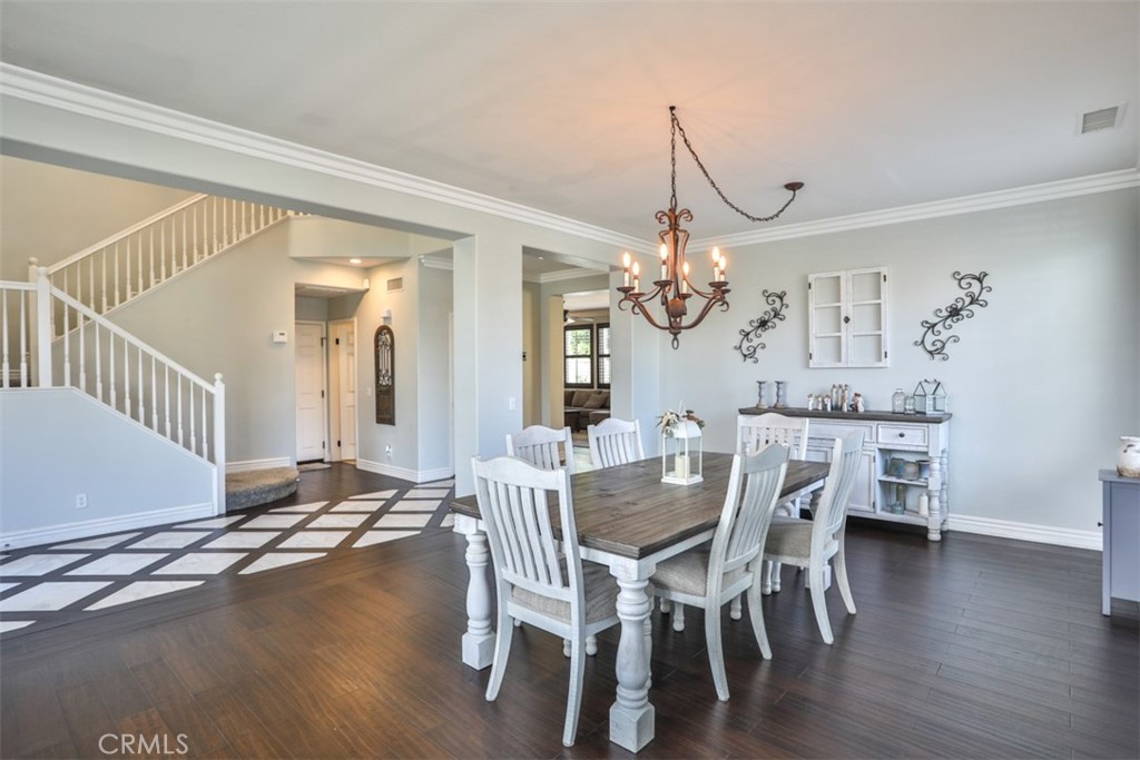 3250 Quartz Circle Corona, CA 92882 - Photo 9 of 68 a view of a dining room with furniture and wooden floor