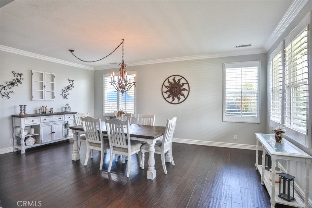 3250 Quartz Circle Corona, CA 92882 - Photo 10 of 68 a view of a dining room with furniture window and wooden floor