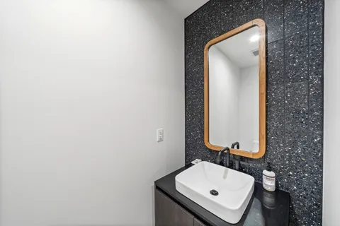 a bathroom with a sink and a mirror