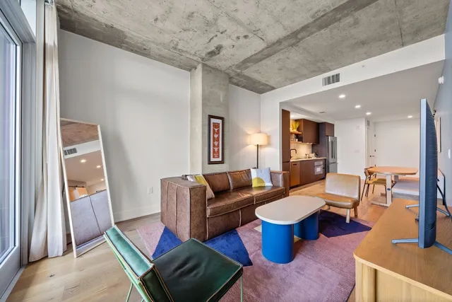 a living room with furniture and a table