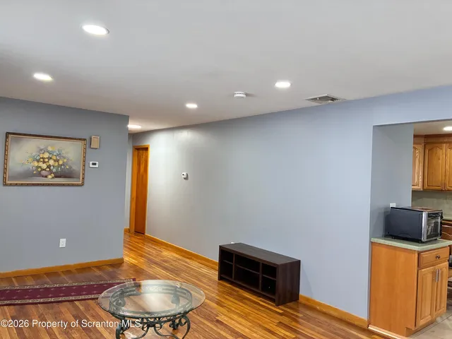 a room with furniture and a wooden floor