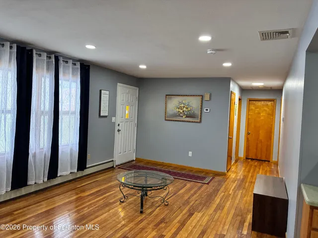 a view of a livingroom with furniture and wooden floor