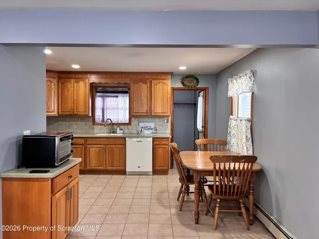 a kitchen with a sink cabinets and window