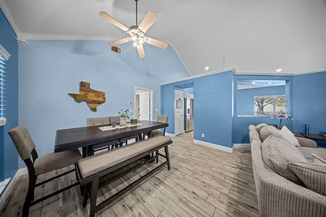 a bedroom with furniture and a chandelier