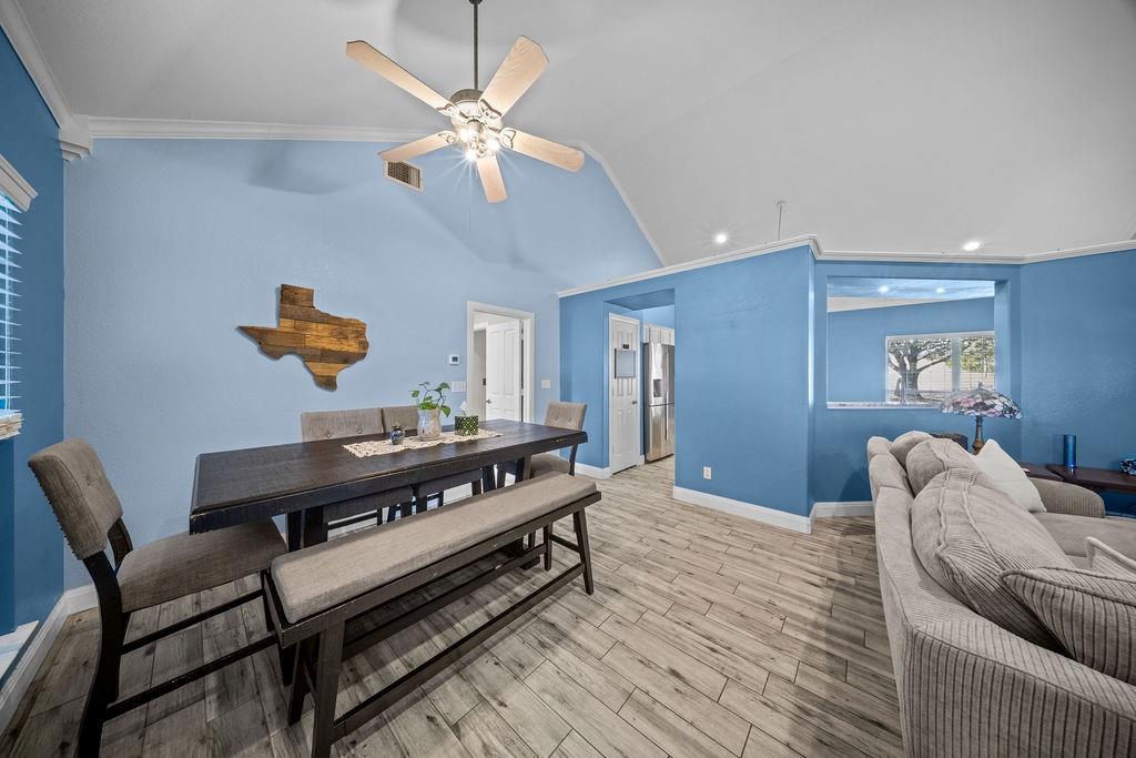 831 Union Hill Road Ennis, TX 75119 - Photo 15 of 36 a bedroom with furniture and a chandelier