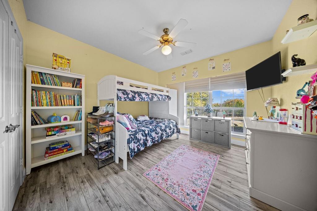 831 Union Hill Road Ennis, TX 75119 - Photo 24 of 36 a bed room with furniture and a flat screen tv