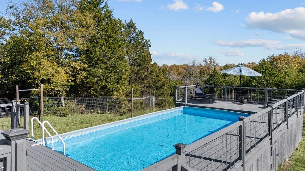 831 Union Hill Road Ennis, TX 75119 - Photo 26 of 36 a view of a swimming pool with a patio