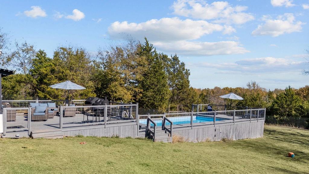 831 Union Hill Road Ennis, TX 75119 - Photo 27 of 36 a view of a swimming pool with a patio and a yard