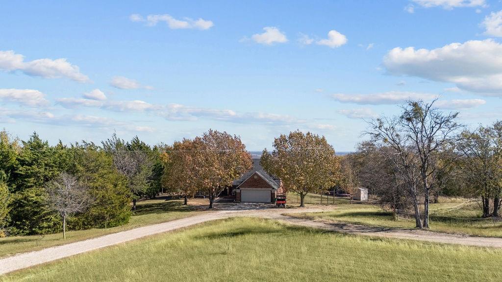 831 Union Hill Road Ennis, TX 75119 - Photo 35 of 36 a view of a house with swimming pool and a yard