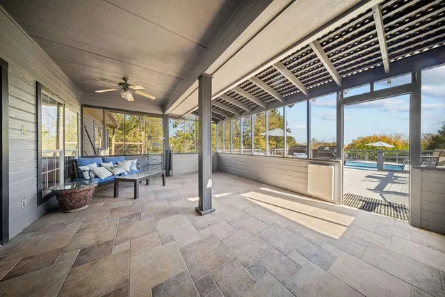 a view of a chairs and table in a patio