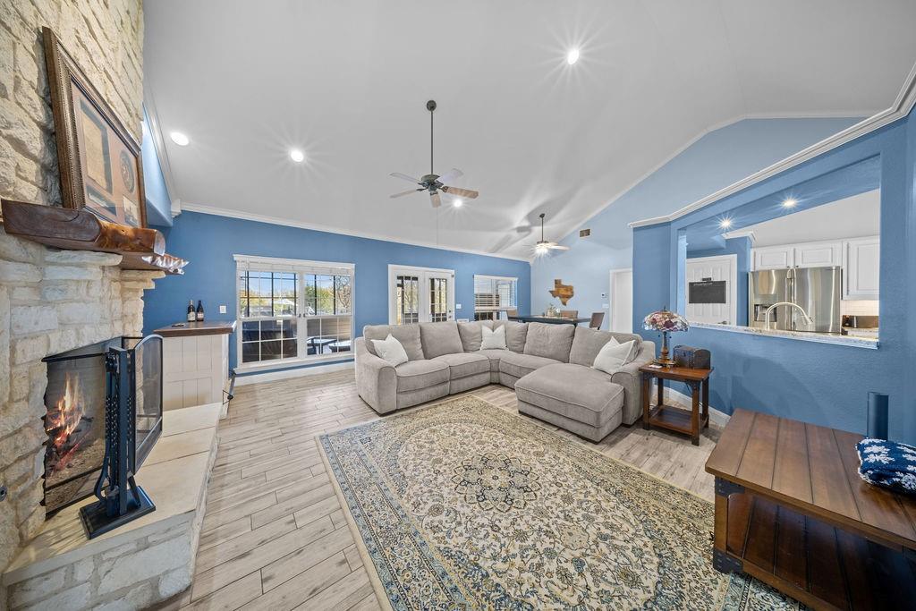 831 Union Hill Road Ennis, TX 75119 - Photo 5 of 36 a living room with furniture and a fireplace