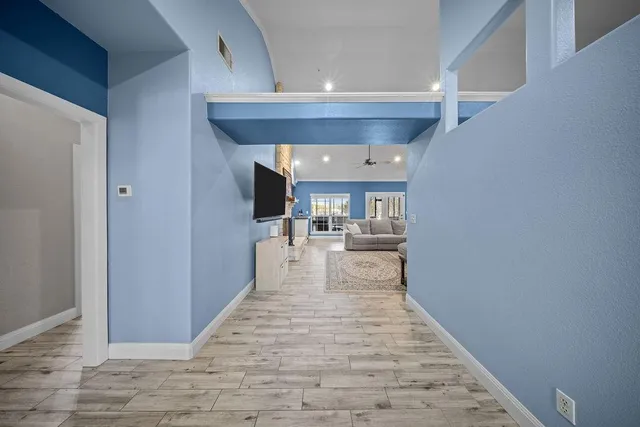 a view of a living room with a wooden floor