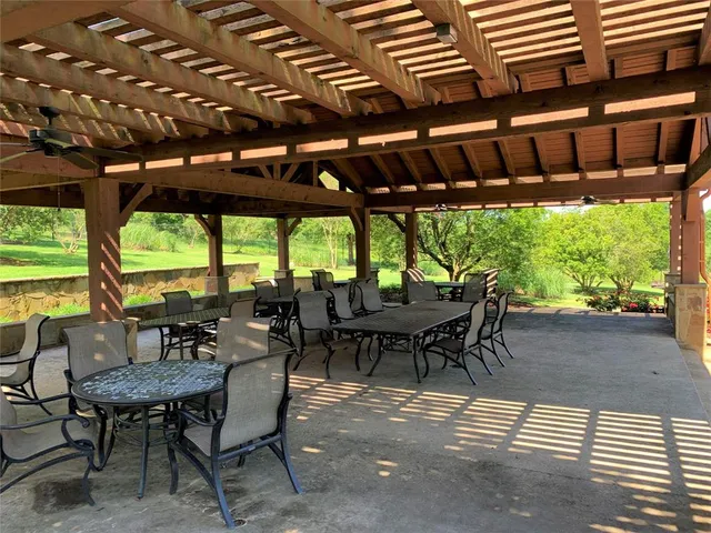 a dining room with furniture and a garden