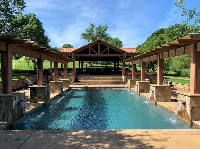 a view of a swimming pool with a patio