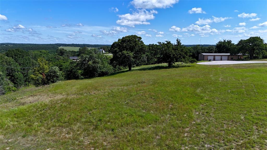 Lot 262 High Point Court Athens, TX 75752 - Photo 8 of 17 a view of a big yard with a house in the background
