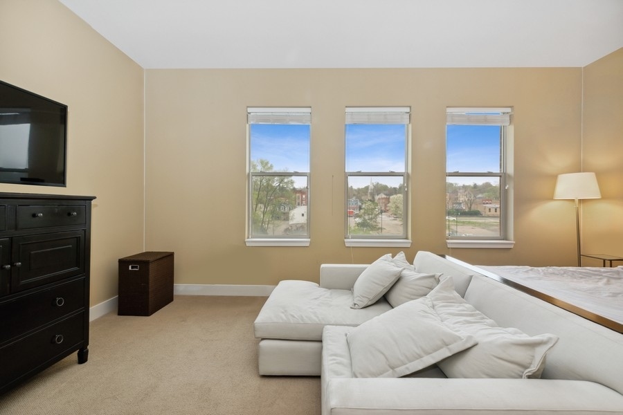 339 Front Street, Unit 2207 Lemont, IL 60439 - Photo 11 of 27 a living room with furniture and a window
