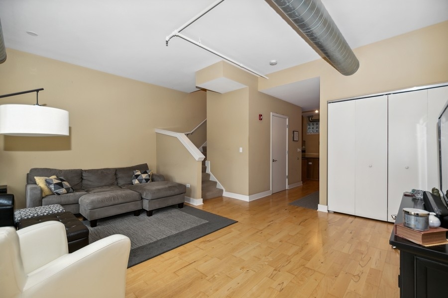 339 Front Street, Unit 2207 Lemont, IL 60439 - Photo 3 of 27 a living room with furniture and a ceiling fan