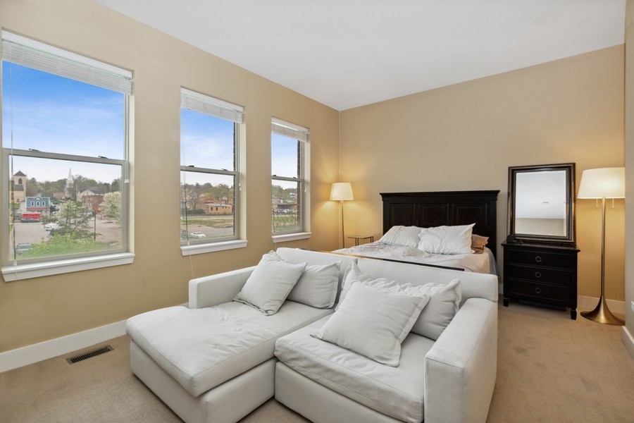 339 Front Street, Unit 2207 Lemont, IL 60439 - Photo 10 of 27 a bedroom with a bed and a couch