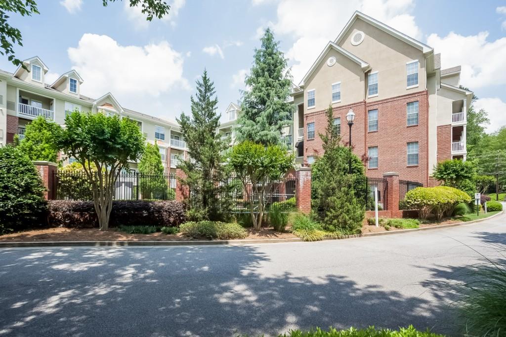 1332 Westchester Ridge Northeast, Unit 1332 Atlanta, GA 30329 - Photo 1 of 1 a couple of cars parked in front of a house