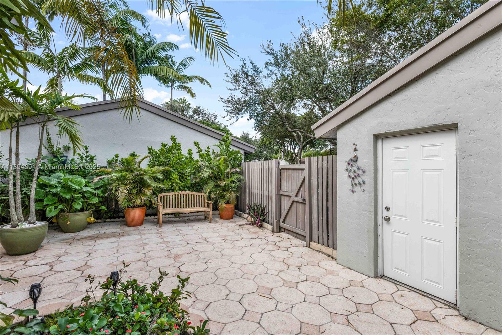 10500 Southwest 112th Avenue Miami, FL 33176 - Photo 3 of 17 Courtyard Garage Entry