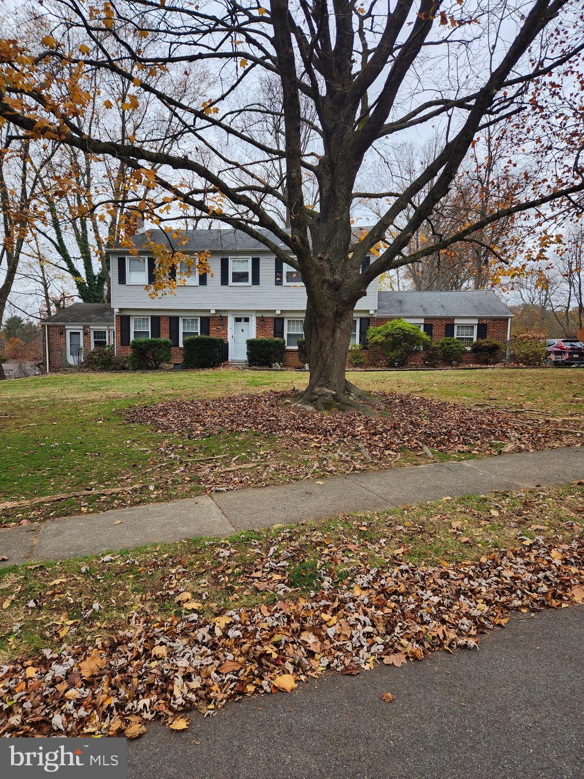 2500 Grant Road Broomall, PA 19008 - Photo 1 of 1 a white house covered with trees in the background