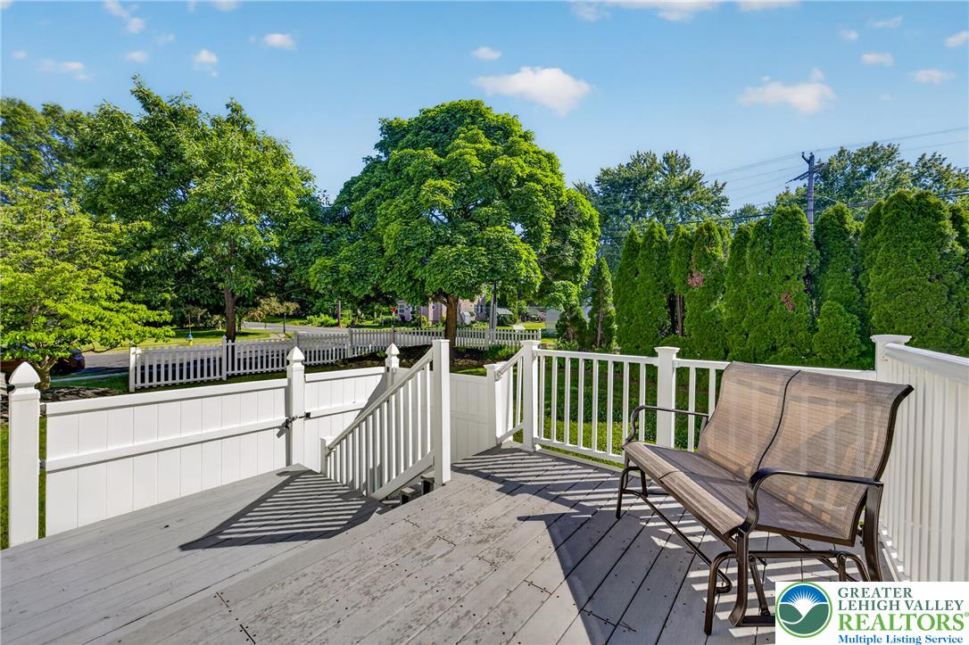1702 Red Bud Road Quakertown, PA 18951 - Photo 64 of 68 Relax on the expansive deck with views of the lush, tree-lined yard and charming picket fence.