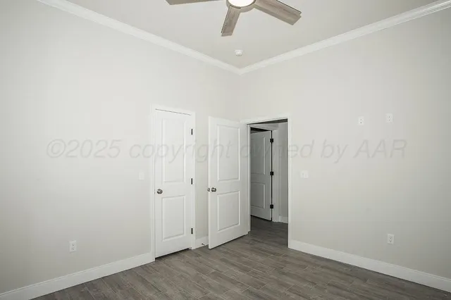 an empty room with wooden floor