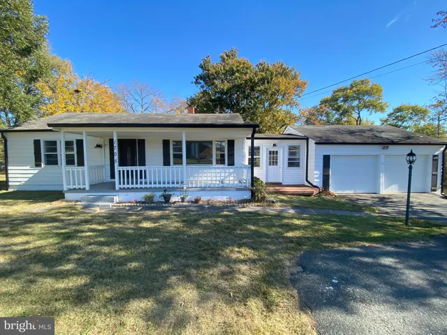 a backyard of a house with seating space