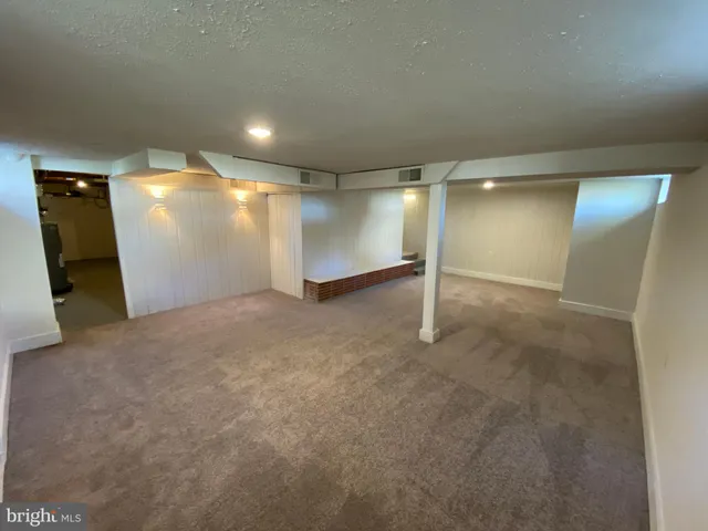 a view of a room with wooden walls