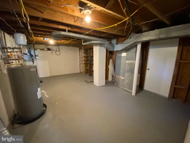 a view of a backyard with wooden fence