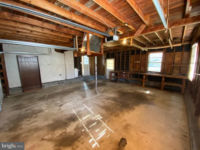 a backyard of a house with large trees