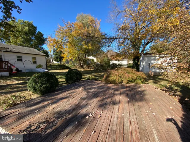a view of a patio with wooden floor