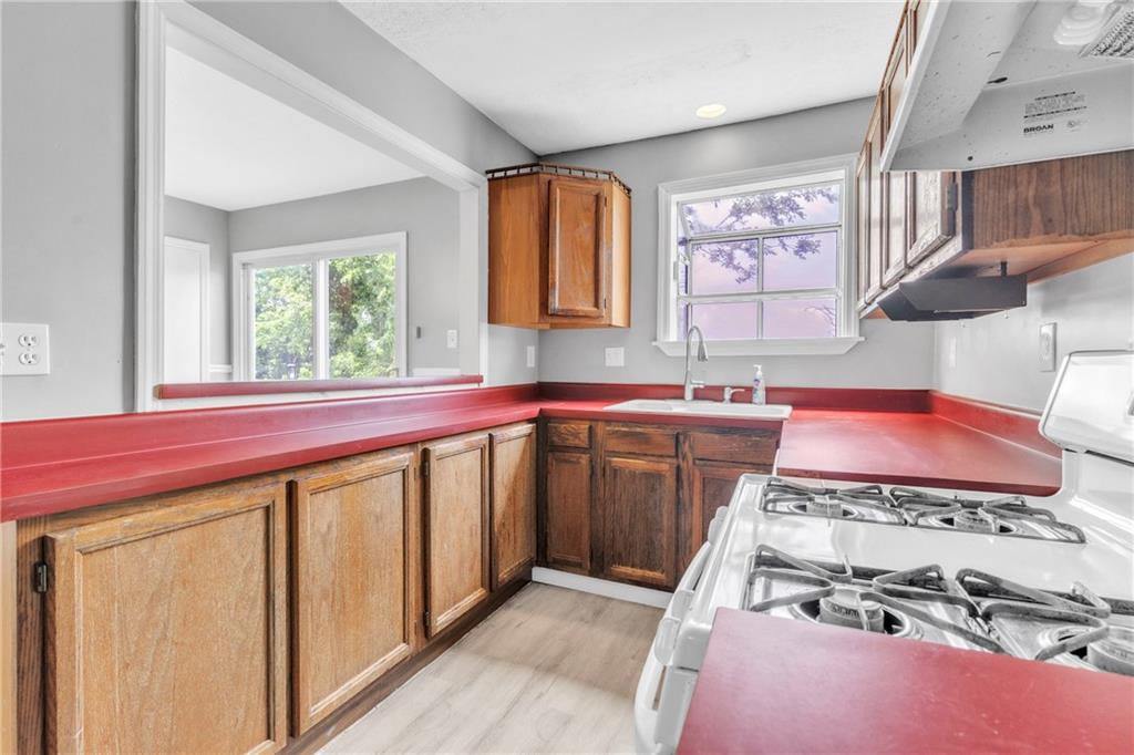 530 Griffin Street Pittsburgh, PA 15211 - Photo 12 of 41 a kitchen with a stove a sink and a refrigerator