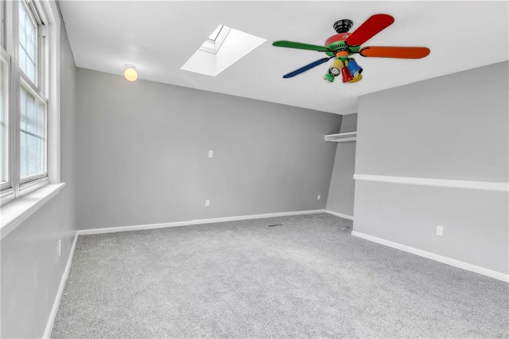 530 Griffin Street Pittsburgh, PA 15211 - Photo 18 of 41 an empty room with a window and a chandelier fan