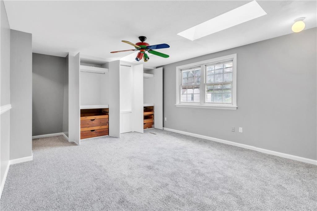 530 Griffin Street Pittsburgh, PA 15211 - Photo 19 of 41 an empty room with windows and ceiling fan