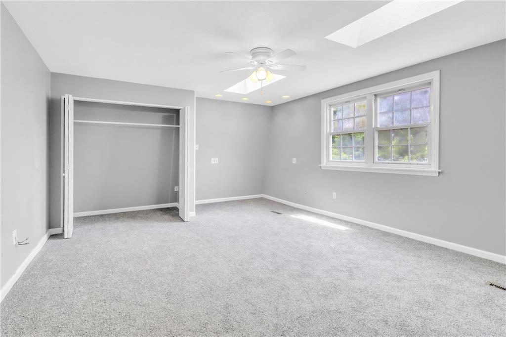 530 Griffin Street Pittsburgh, PA 15211 - Photo 20 of 41 an empty room with windows and chandelier fan