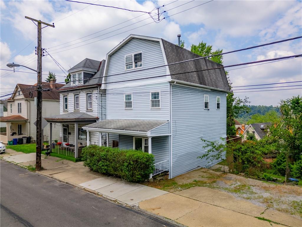 530 Griffin Street Pittsburgh, PA 15211 - Photo 2 of 41 a front view of a house with garden