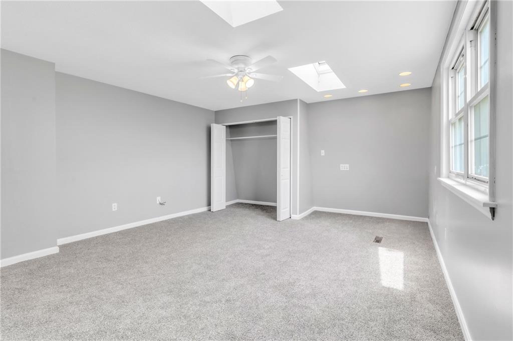 530 Griffin Street Pittsburgh, PA 15211 - Photo 21 of 41 an empty room with chandelier fan and windows