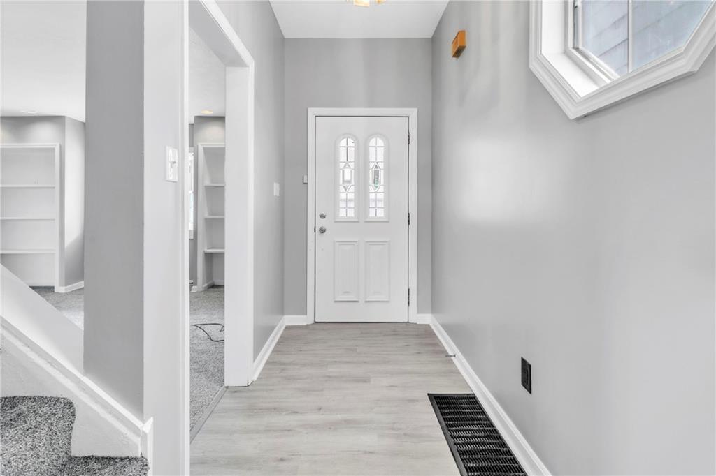 530 Griffin Street Pittsburgh, PA 15211 - Photo 5 of 41 a view of a hallway with wooden floor and staircase