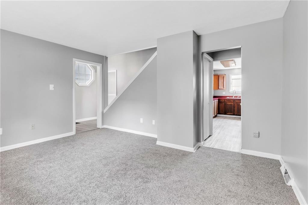530 Griffin Street Pittsburgh, PA 15211 - Photo 7 of 41 a view of an empty room with wooden floor and entryway