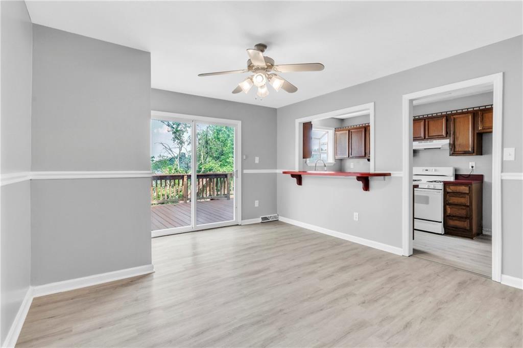 530 Griffin Street Pittsburgh, PA 15211 - Photo 8 of 41 a view of a kitchen with wooden floor and a ceiling fan